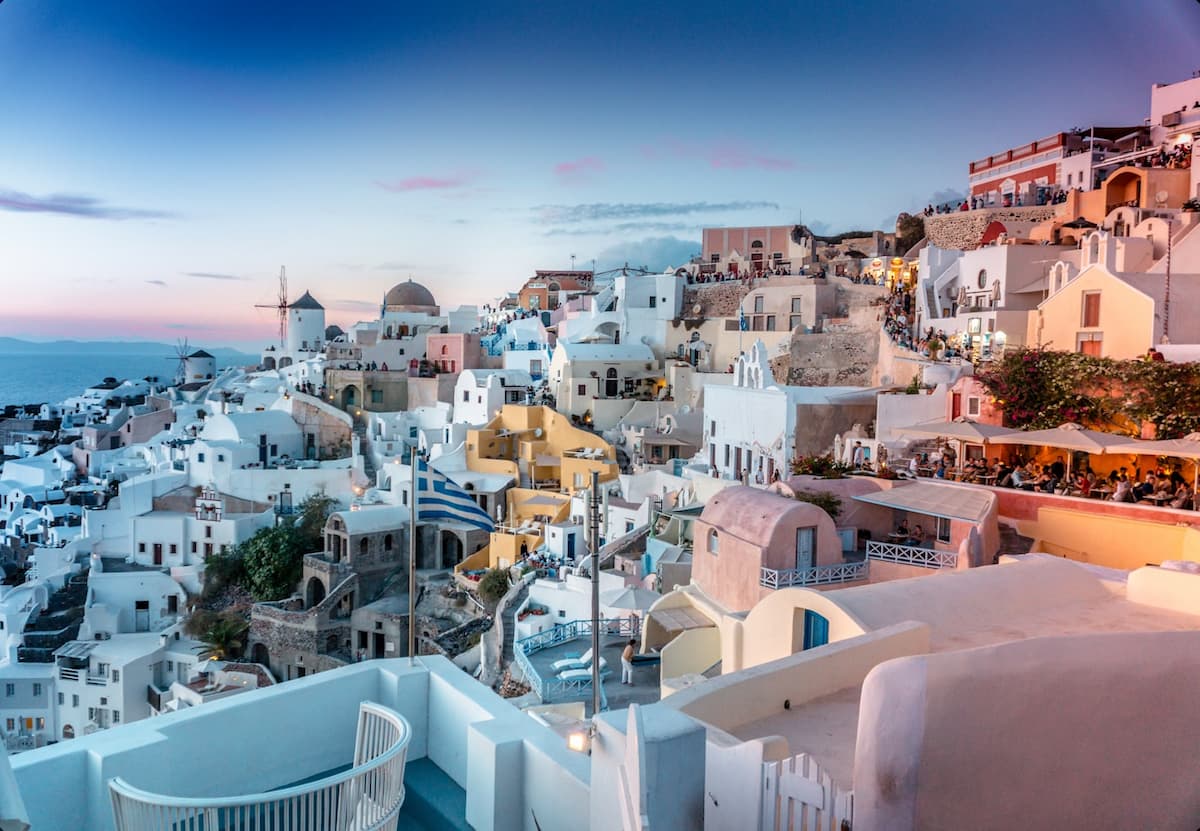 White-washed buildings and blue domes overlooking the Aegean Sea in Santorini